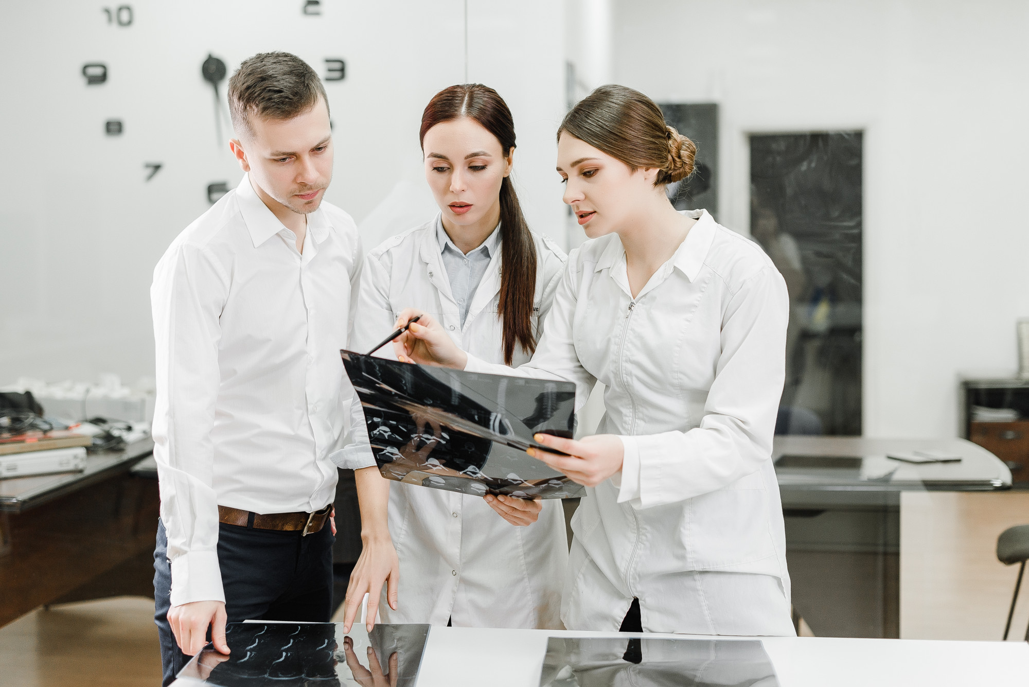 Instructor guiding a small group in a modern kitchen