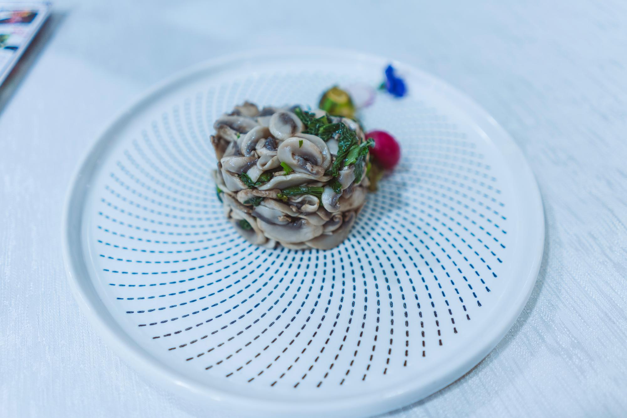 Plated dish with modern garnish